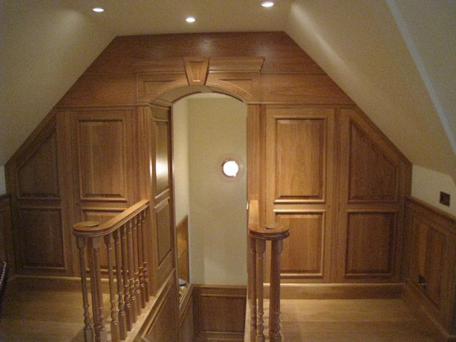 Oak panelling around a loft landing