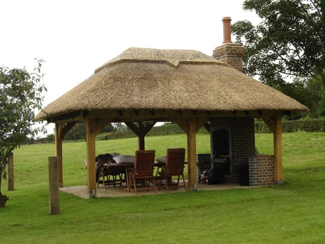 Thatched oak-framed garden shelter