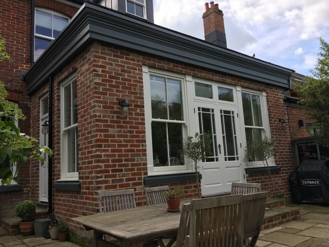 Brick single-storey extension with French doors