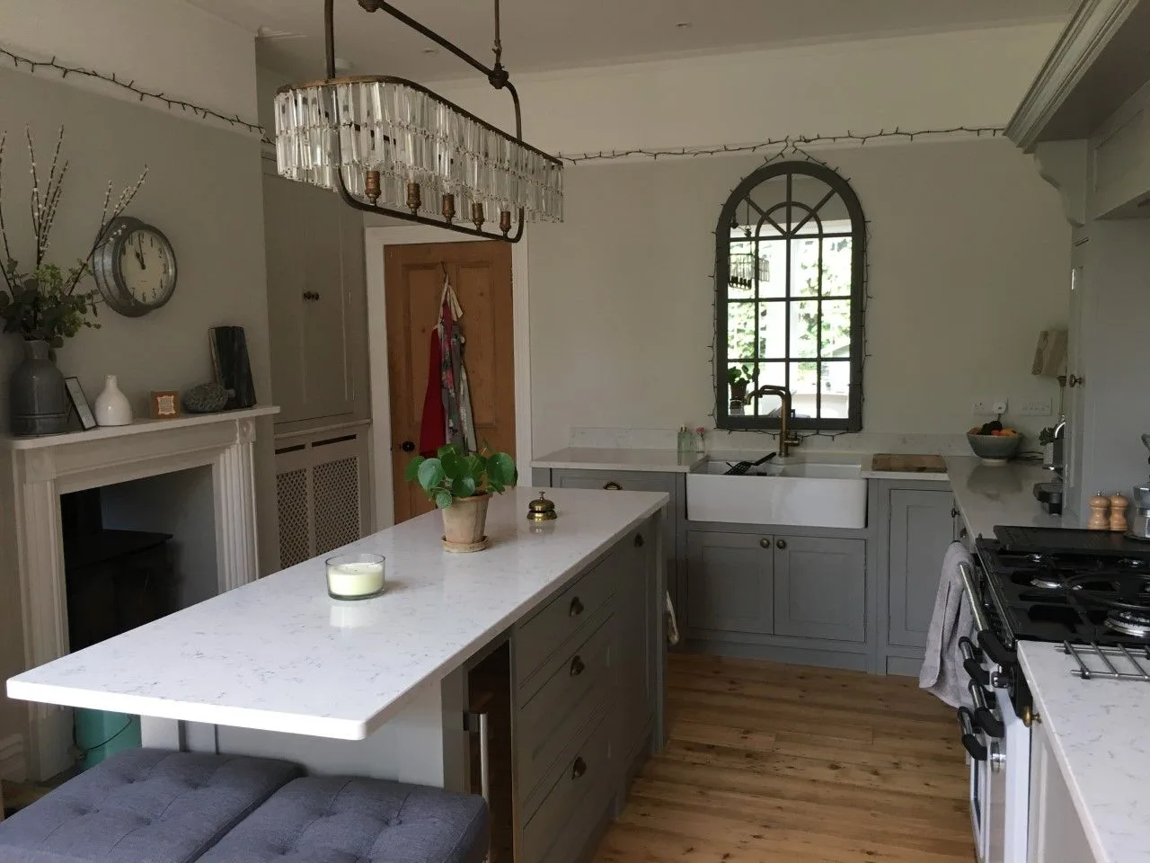 Decorated kitchen with an island and arched window in Southampton