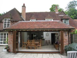 Oak-framed single-storey extension with bi-fold doors on a period house