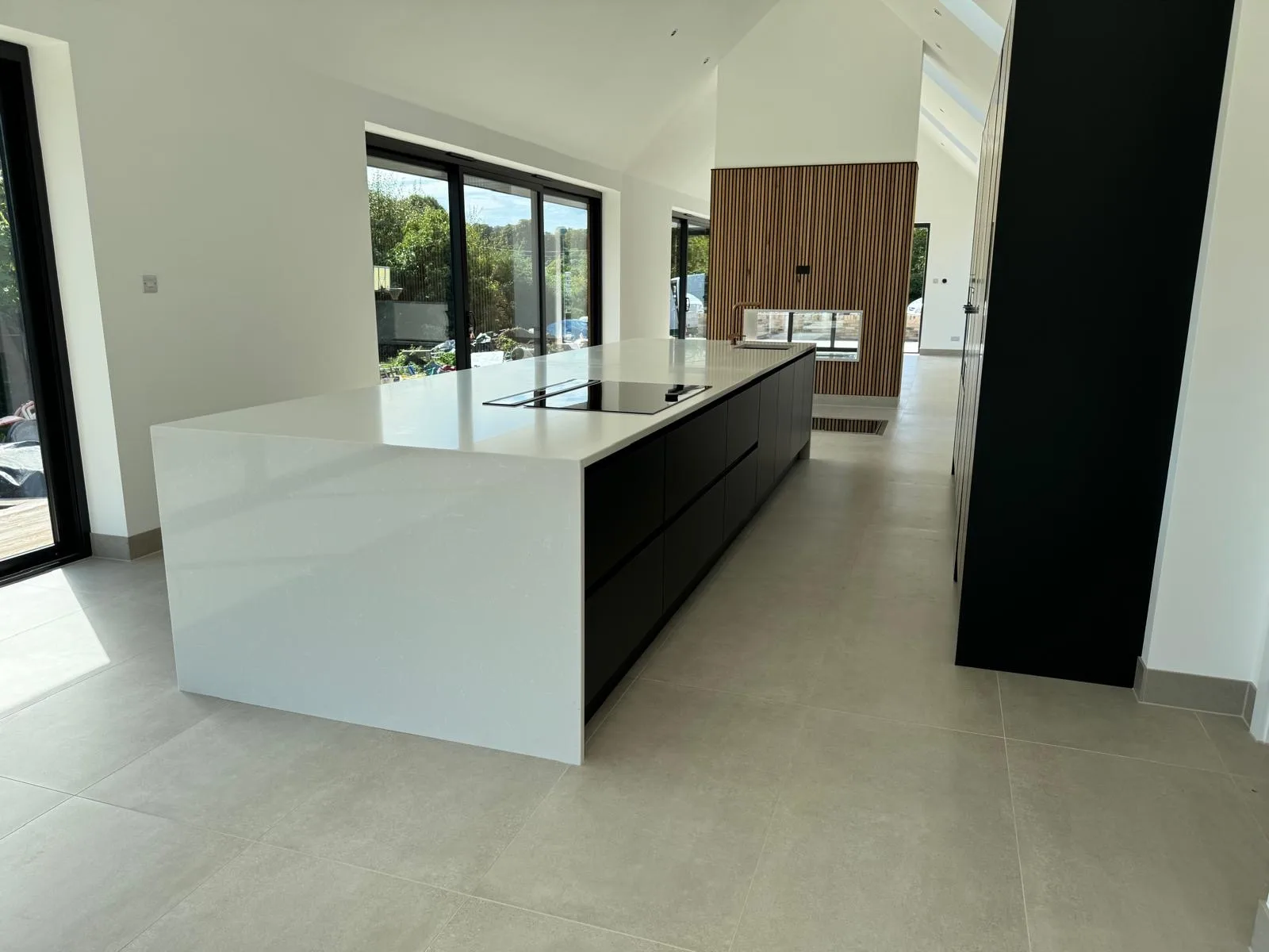 Shaker-style kitchen with an island and pendant lights