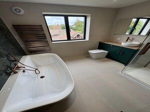 comprehensive look at a high-end refurbishment, highlighting the seamless integration of modern plumbing and premium finishes.